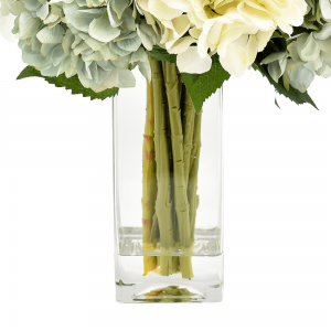 Creative Displays Assorted hydrangea, lamb’s ear and protea arrangement in clear glass