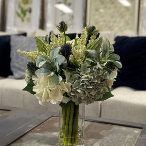 Creative Displays Assorted hydrangea, lamb’s ear and protea arrangement in clear glass