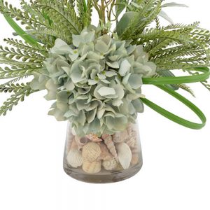 Creative Displays Floral Arrangement with Seafoam Hydrangea, Lambs Ear, Fern, Shells, Vine and Grass Blade in Clear Glass Vase