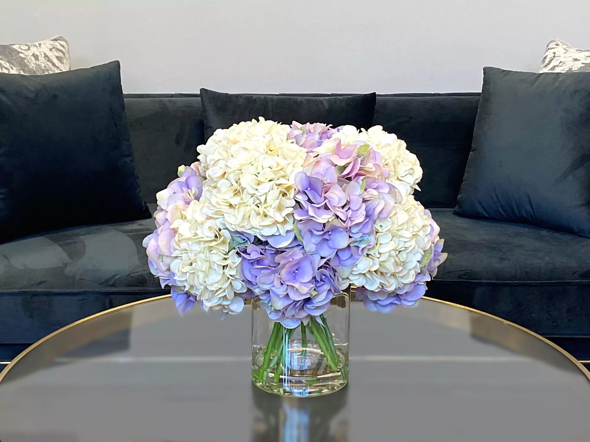 Assorted Hydrangea Floral Arrangement in a Clear Glass Vase