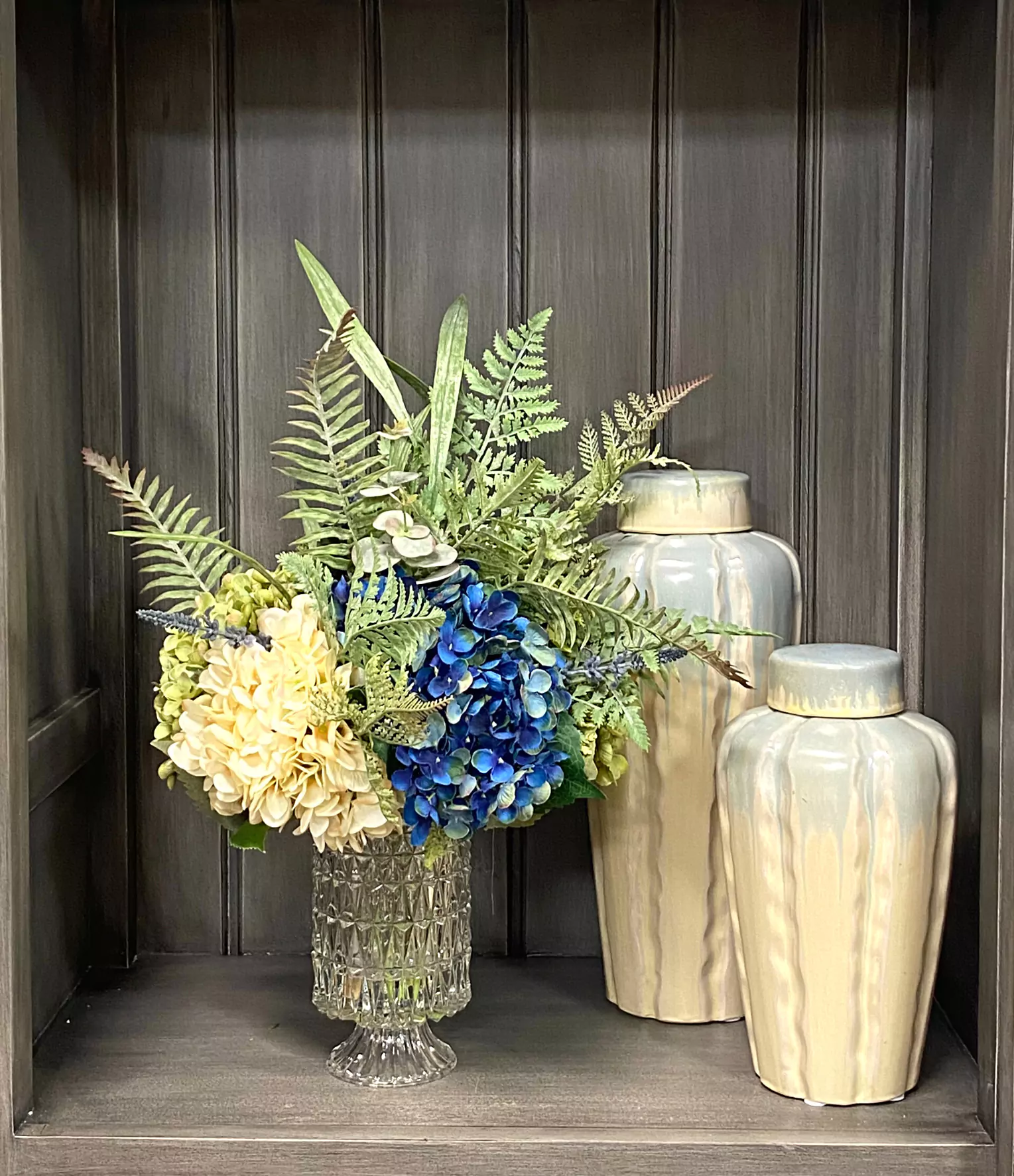 Assorted Hydrangea Arrangement with Mixed Fern in a Glass Pedestal Vase