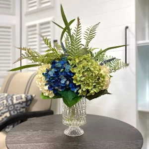 Assorted Hydrangea Arrangement with Mixed Fern in a Glass Pedestal Vase