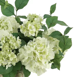 Hydrangea Floral Arrangement in a Clear Glass Vase with Seashells