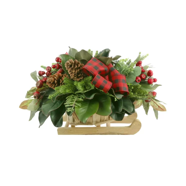 Magnolia, Cedar and Berry Holiday Arrangement in a Wooden Sled