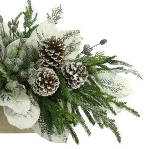 Magnolia Leaf Holiday Arrangement with Pinecones in an Oval Ceramic Pot