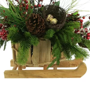 Evergreen Holiday Arrangement with Snowy Berries and Bird's Nest in a Wooden Sleigh